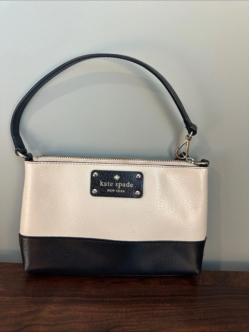 Classic Kate Spade New York small handbag in an ivory/cream and black colorblock